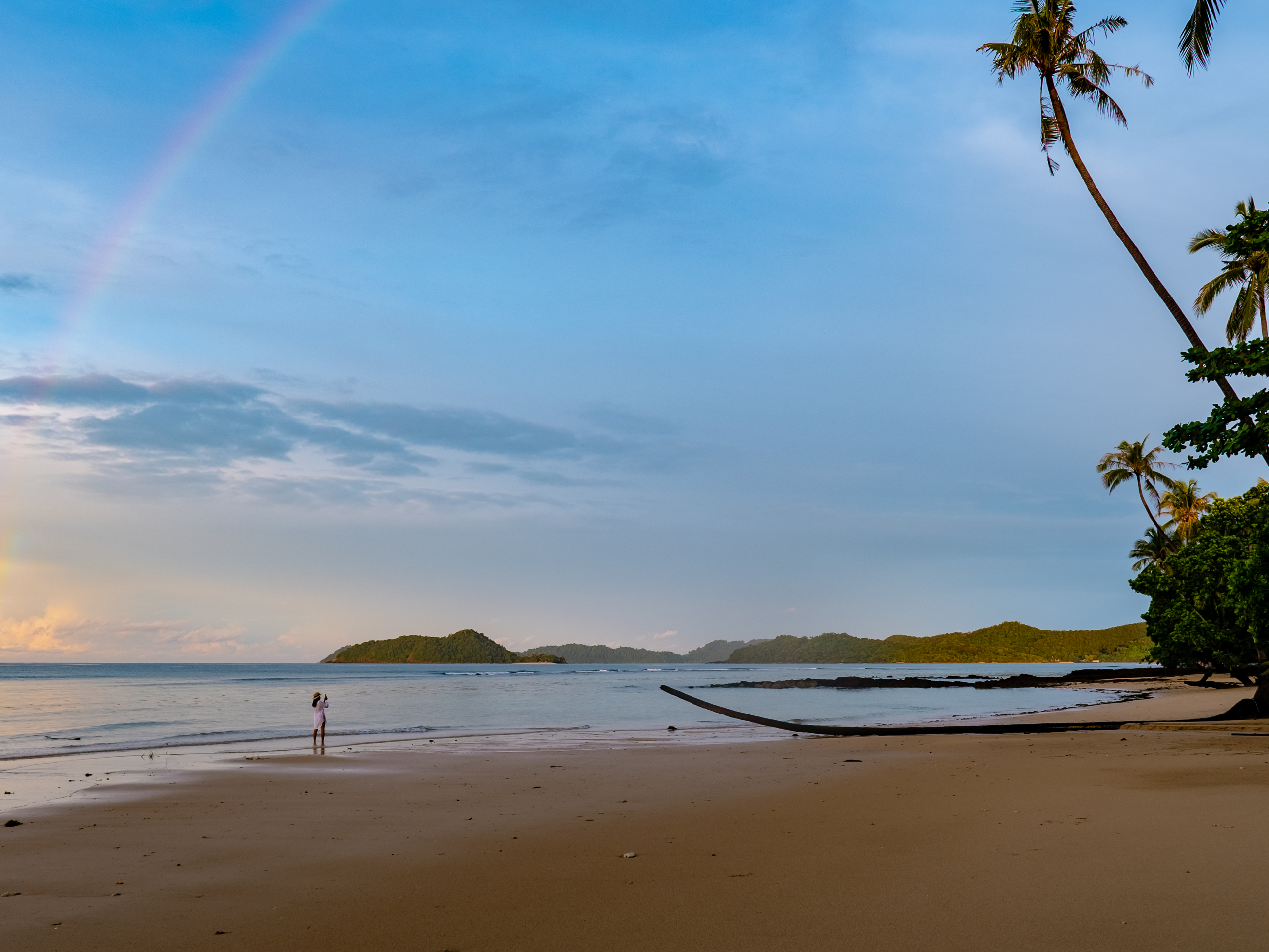 snorkelling-at-the-tug-boat-wreck-with-lots-of-fis-2026-03-26-00-18-15-utc_0002_asian-women-looking-at-a-rainbow-on-the-